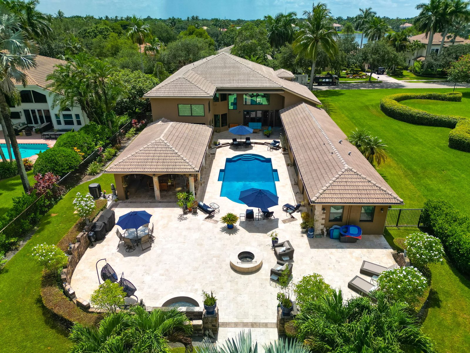 Aerial view of the estate, resort pool and grounds within Long Lake Estates